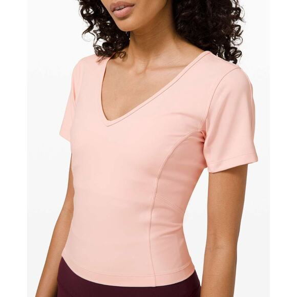 (4) $68 Lululemon Nulu Cropped Slim Yoga Short Sleeve Pink Mist - Picture 3 of 8